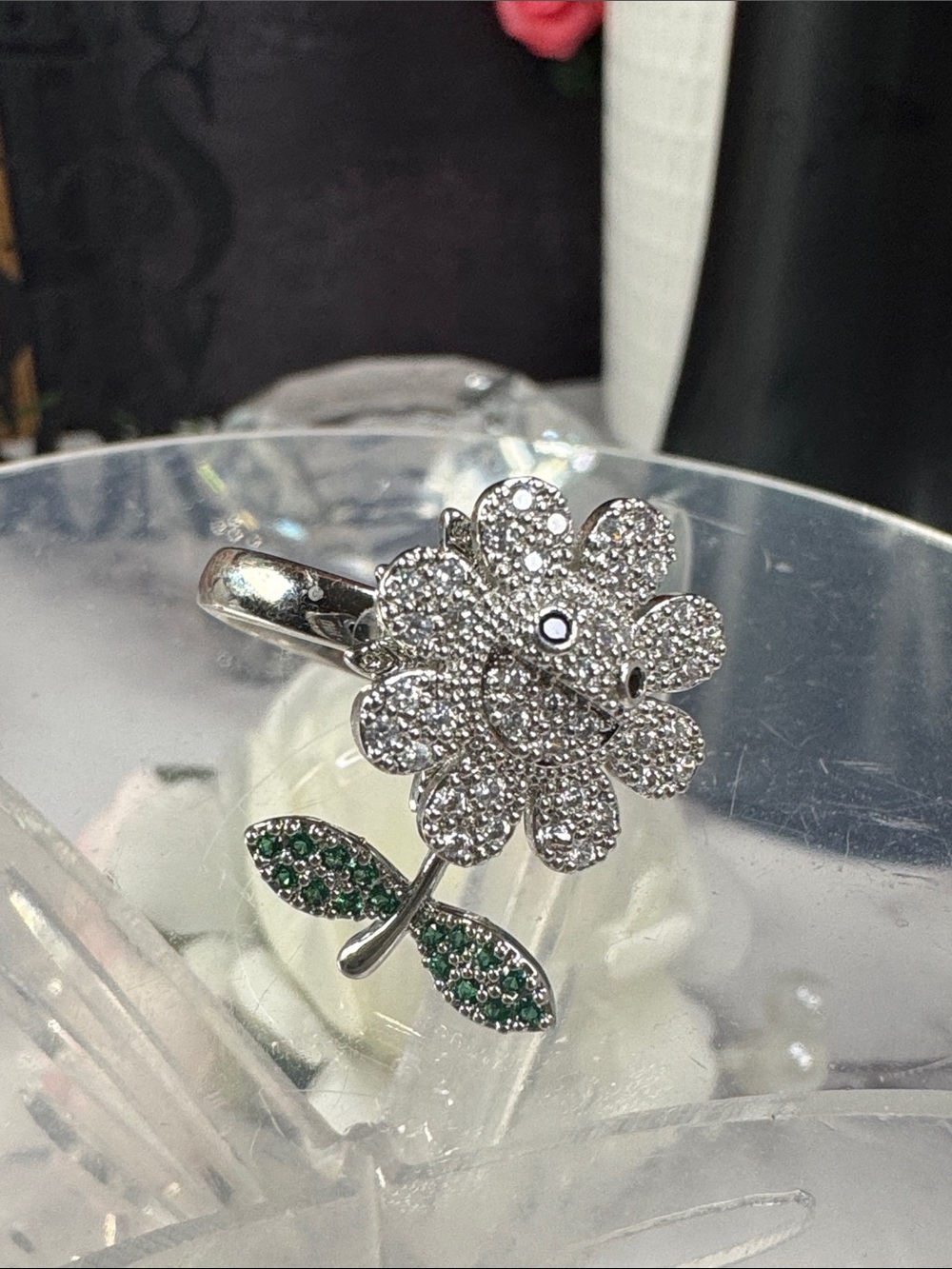 Sterling Silver Flower Ring with Clear Stones and Green Leaf Accents